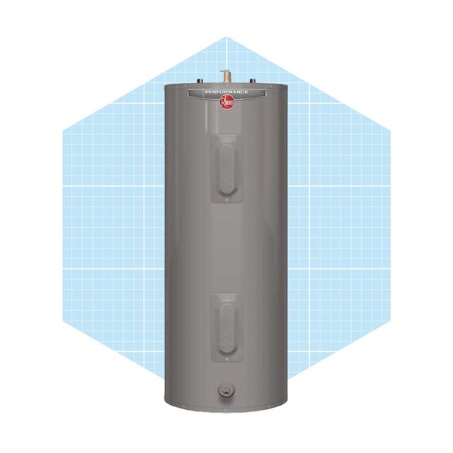 A cylindrical gray water heater stands upright, designed for heating water, set against a light blue geometric background with a grid pattern.