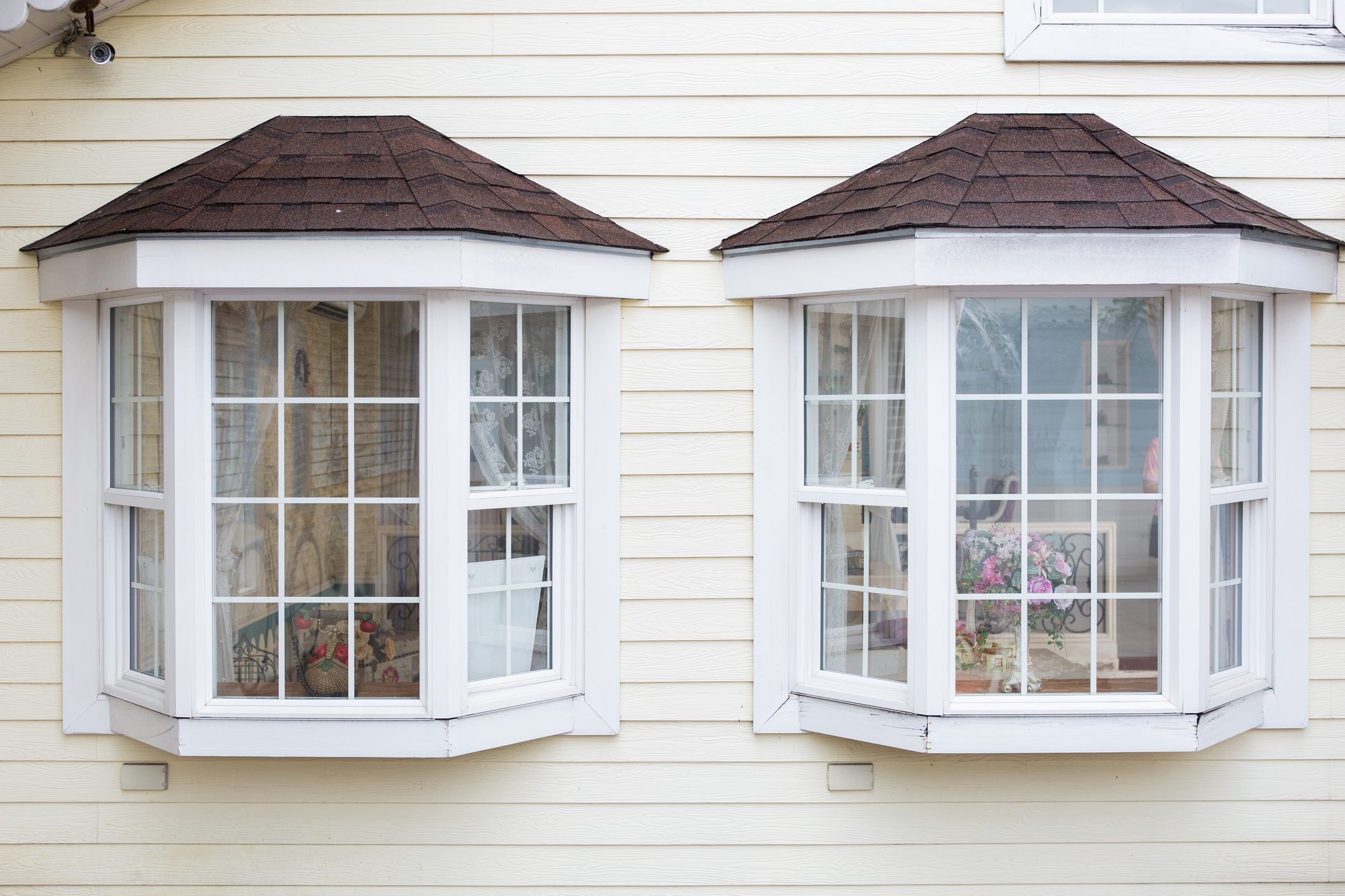 window grids on two windows on exterior of house