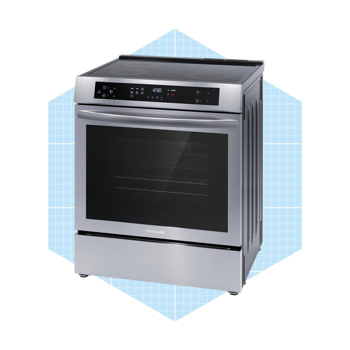 A stainless steel oven stands upright, featuring a glass door and touch controls, set against a light blue geometric background.