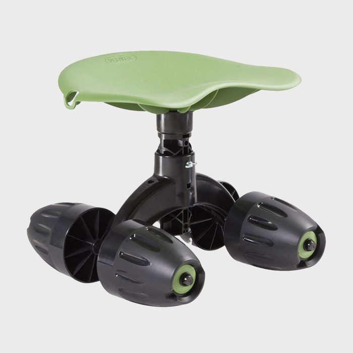 A green, ergonomic stool with three black, wheeled legs is designed for mobility and comfort, suitable for office or workspace environments.