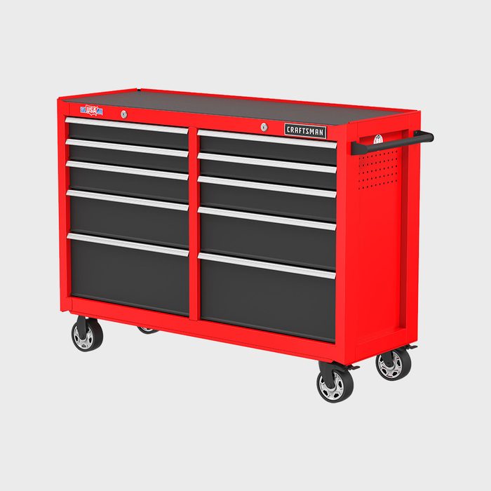 A red tool chest with multiple drawers houses various tools, standing on wheels for mobility, set against a plain background.