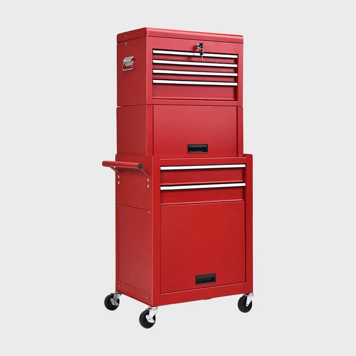A tall red tool chest with multiple drawers is positioned on wheels, designed for organizing and storing tools in a garage or workshop setting.