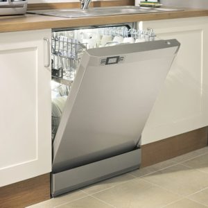 A silver dishwasher with an open door exposes clean dishes inside, positioned under a countertop in a modern kitchen with a sink nearby.