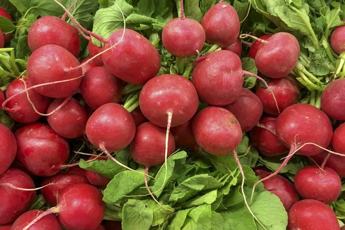 Full Frame Shot Of Organic Raw Radish with Leaves in Market