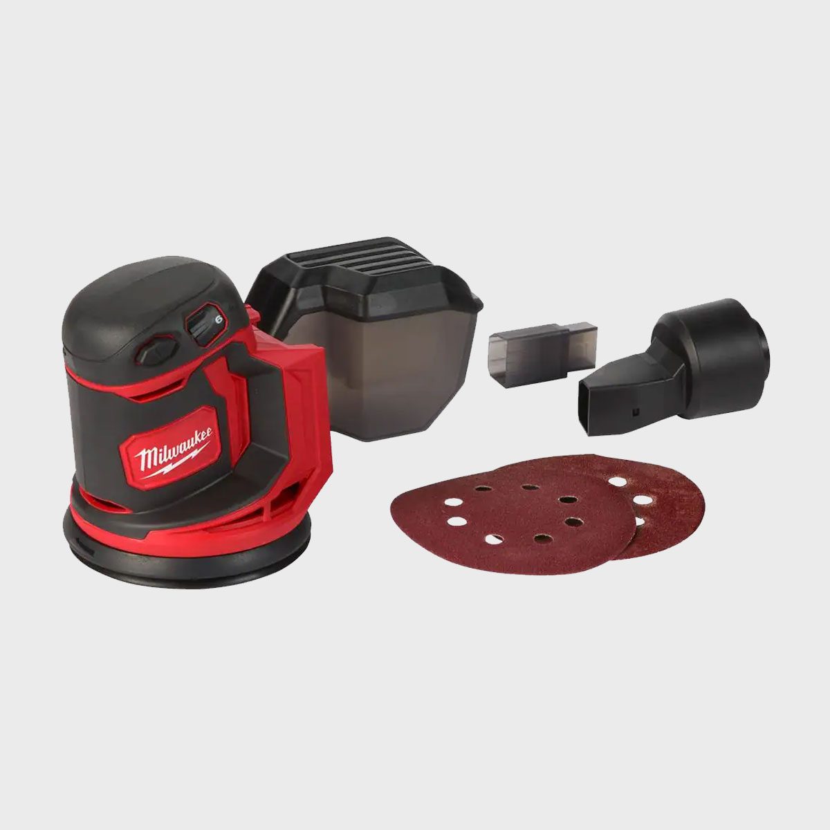 A red and black sander occupies the foreground, with sandpaper discs and accessories nearby, suggesting preparation for a woodworking or finishing project.