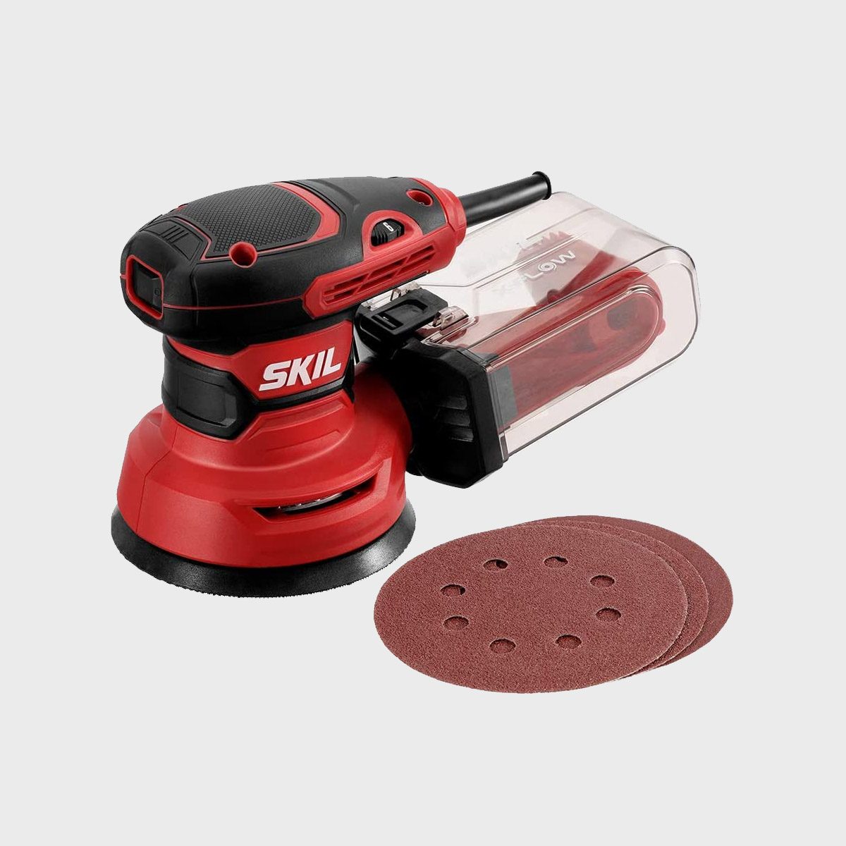 A red and black sander rests on a surface, with sanding discs nearby, ready for use in woodworking or surface finishing tasks.