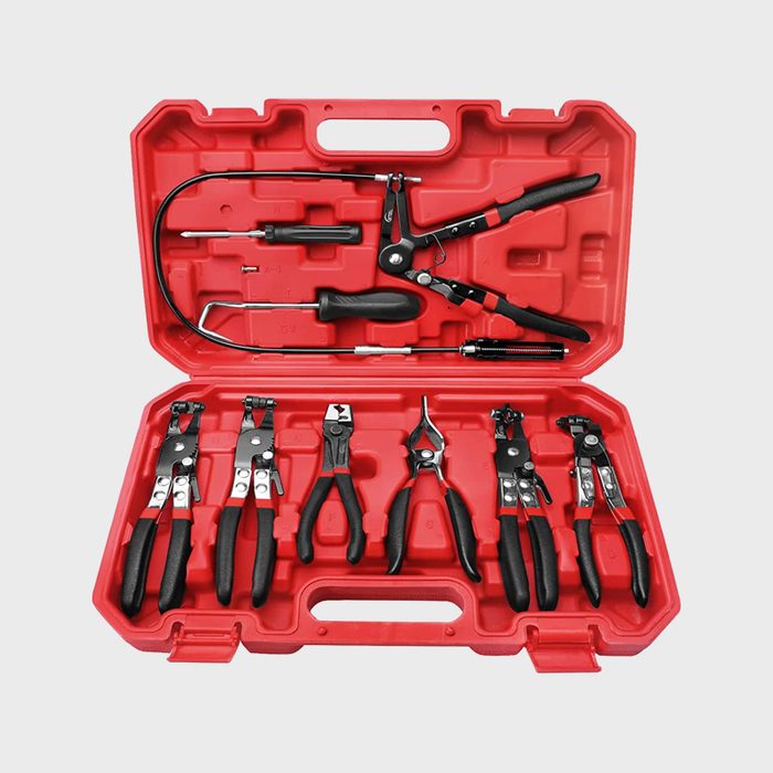 A red tool case contains various pliers and wrenches, arranged neatly and ready for use in automotive or mechanical tasks.