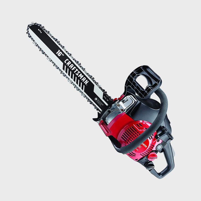 A chainsaw with a 16-inch blade rests on a neutral background, featuring a red and black design, ready for cutting wood.