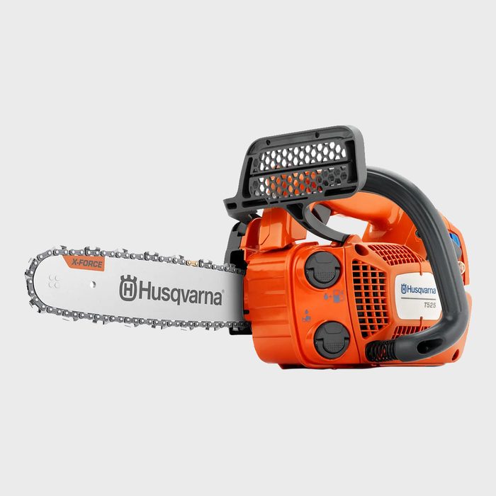 A bright orange chainsaw lies on a gray background, featuring a long metal blade with a saw chain attached, designed for cutting wood.