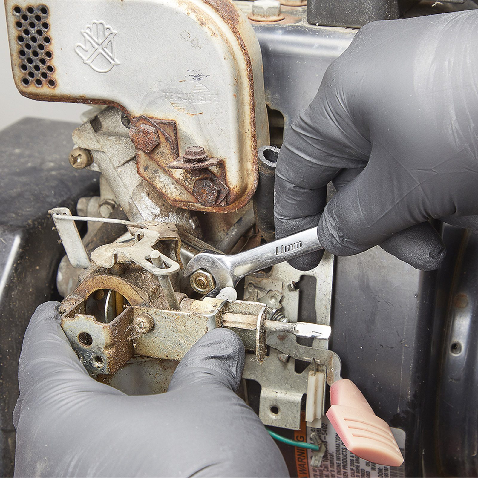 Gardener Pouring Petrol Into Lawn Mower, Surface Level View