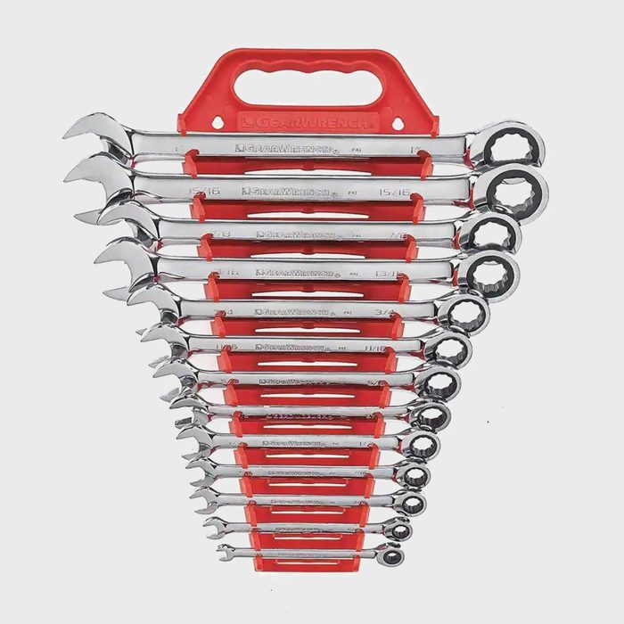 A set of chrome wrenches is arranged in a tiered formation, secured by a red holder, showcasing various sizes for tool use in mechanics.