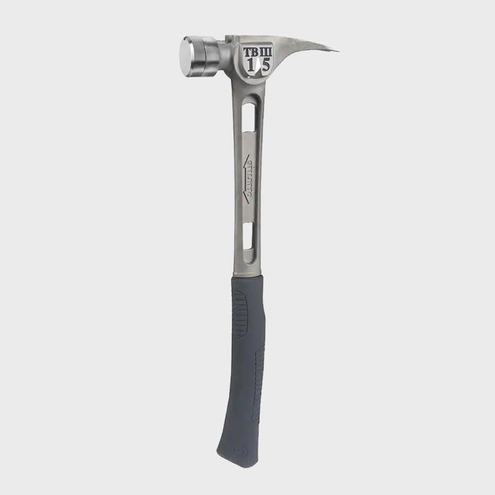 A metal claw hammer rests upright, featuring a textured rubber grip, with a polished head for striking and a curved claw for pulling nails.