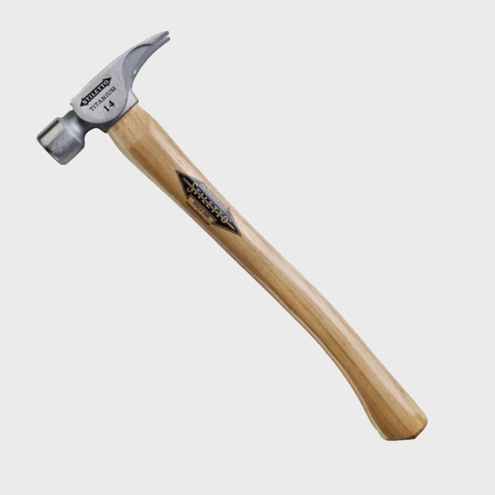 A titanium claw hammer is positioned upright, showcasing a smooth wooden handle and a metallic head with a curved claw, suitable for driving nails.