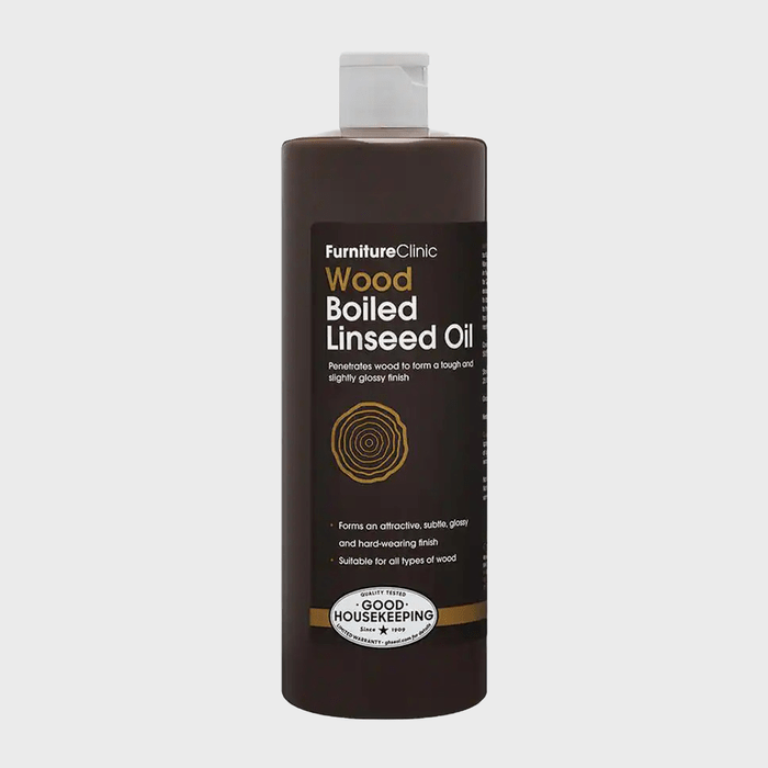 A dark bottle of wood boiled linseed oil sits upright. The product is designed to penetrate wood, providing a tough, glossy finish in a clean background.