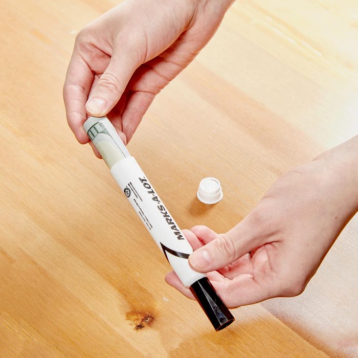 hiding rolled up money in a marker