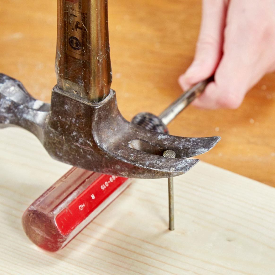 handy hack of using a screwdriver with a hammer to get out a stuck nail
