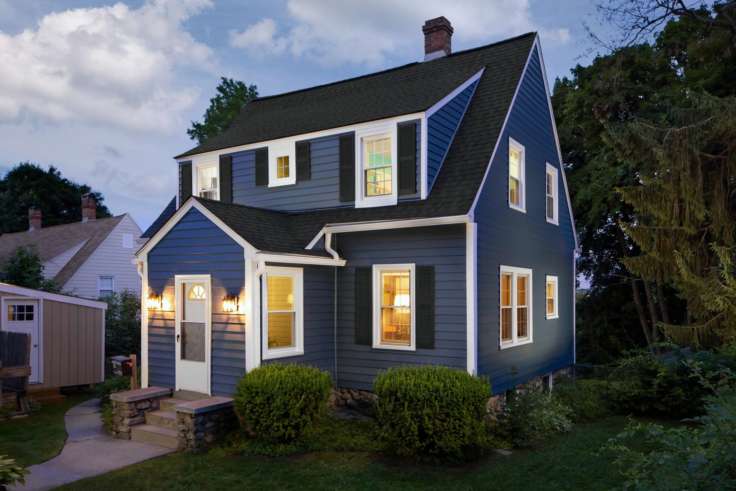 blue house exterior at dusk