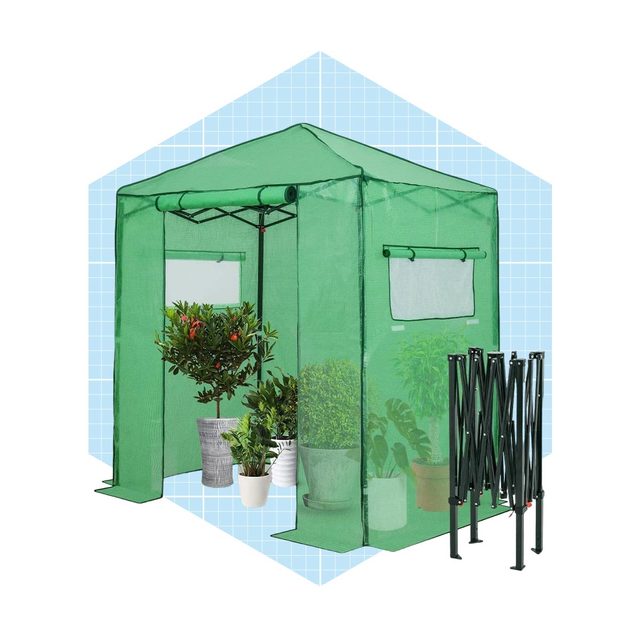 A green plant shelter displays potted plants inside, with open windows for ventilation, set against a light blue grid background. Folding frame is beside the structure.