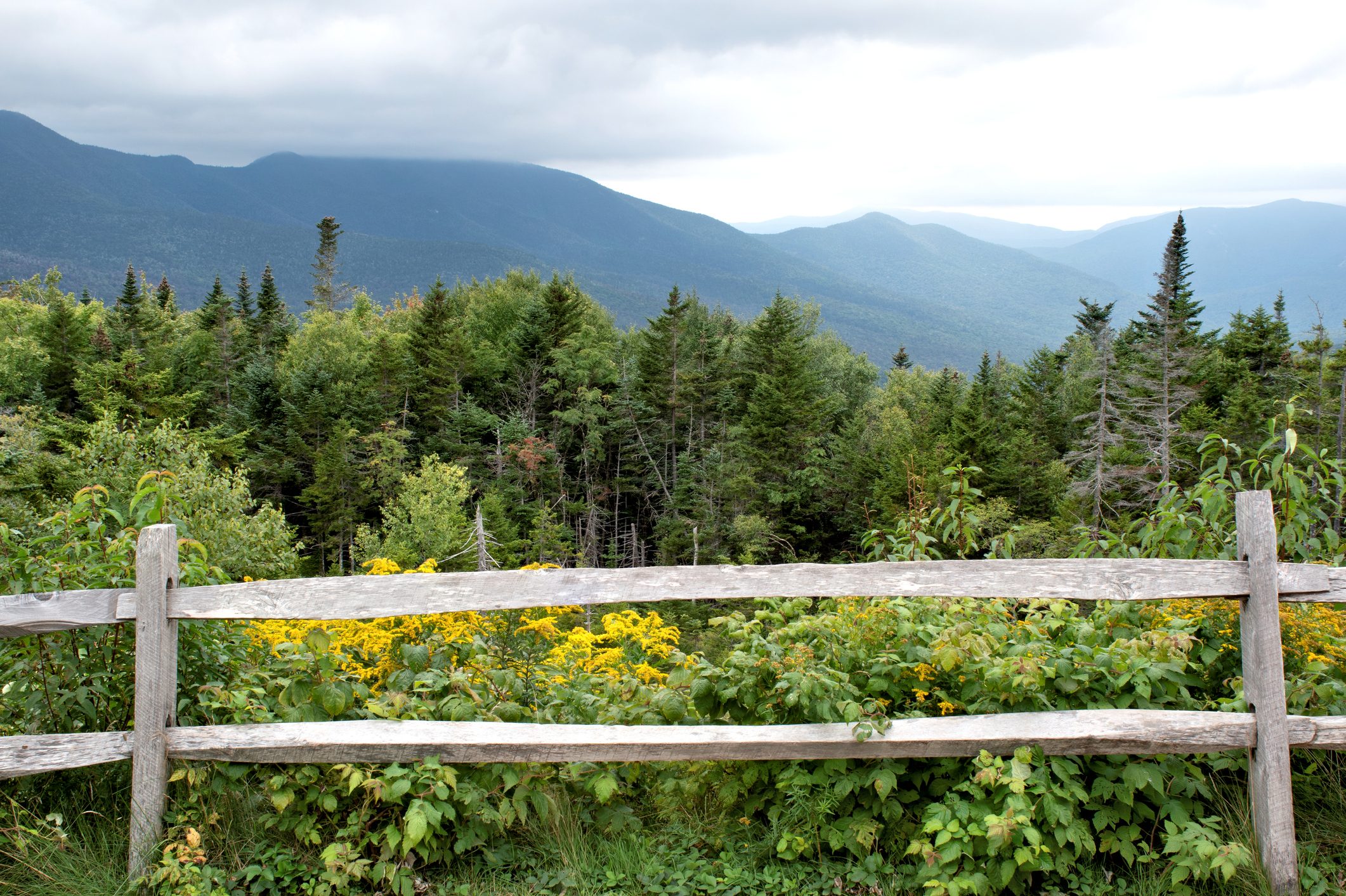 split rail fence with a Mountain View in the background in New Hampshire