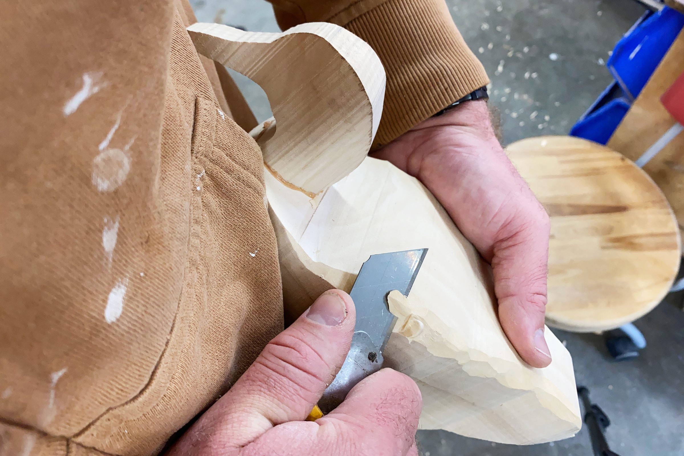 carving a duck from wood with a knife