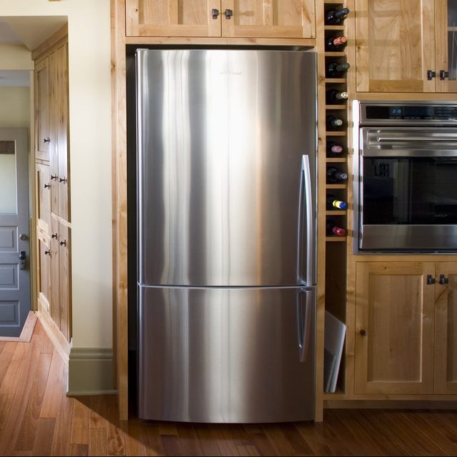 Back Door in Kitchen With Built-In Wood Cabinets