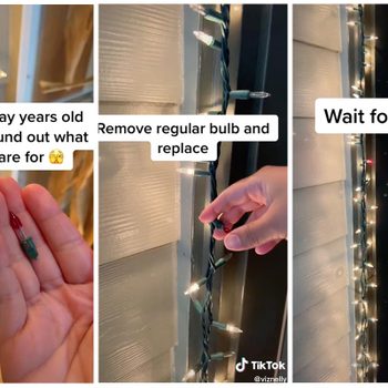 A hand holds a small bulb, replaces it on string lights, expecting a change. Background features a lit door frame with more glowing lights.