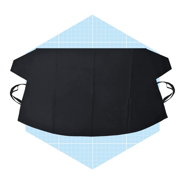 A black apron lies flat, featuring ties on the sides, set against a light blue, grid-patterned background.