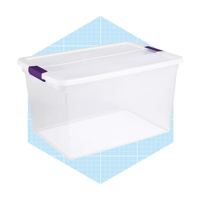 A transparent storage container with a white lid and purple handles sits against a light blue grid background, designed for organizing various items.
