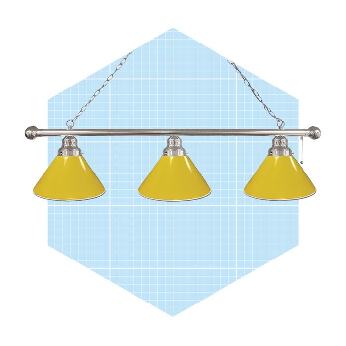 A hanging light fixture with three yellow shades illuminates a grid-patterned blue background, enhancing a modern aesthetic.