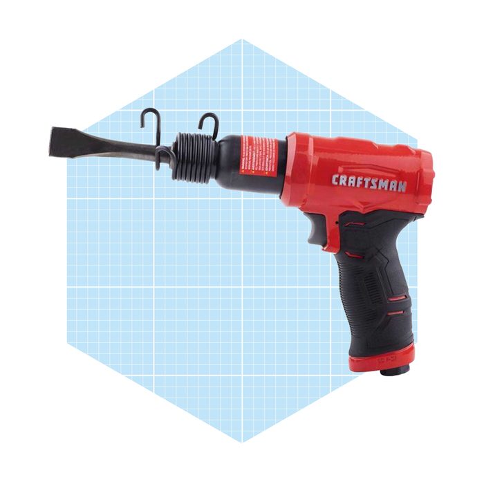 A red and black Craftsman power tool is positioned to the side, featuring a chisel attachment and two hooks, against a light blue grid background.