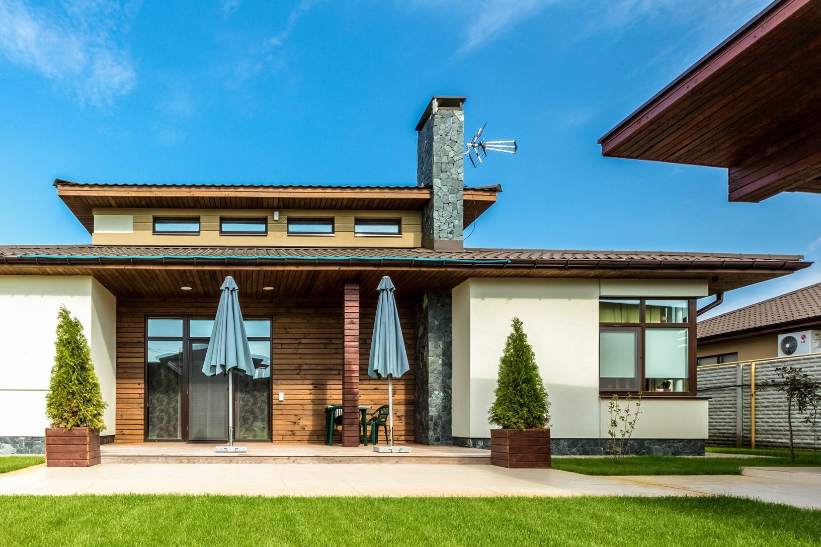 Beautiful modern house in cement, view from the garden