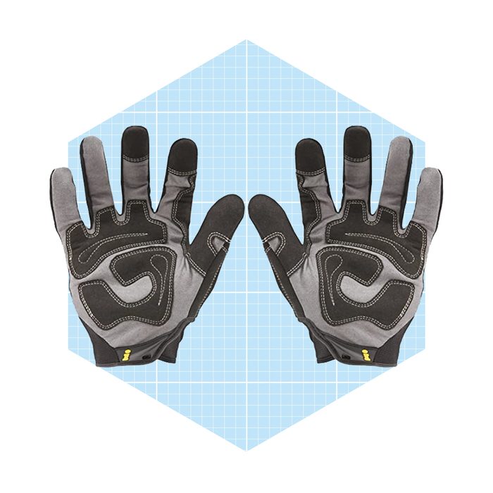 Two pairs of gloves are displayed, palms facing up. They feature a black and gray design, set against a light blue grid background.