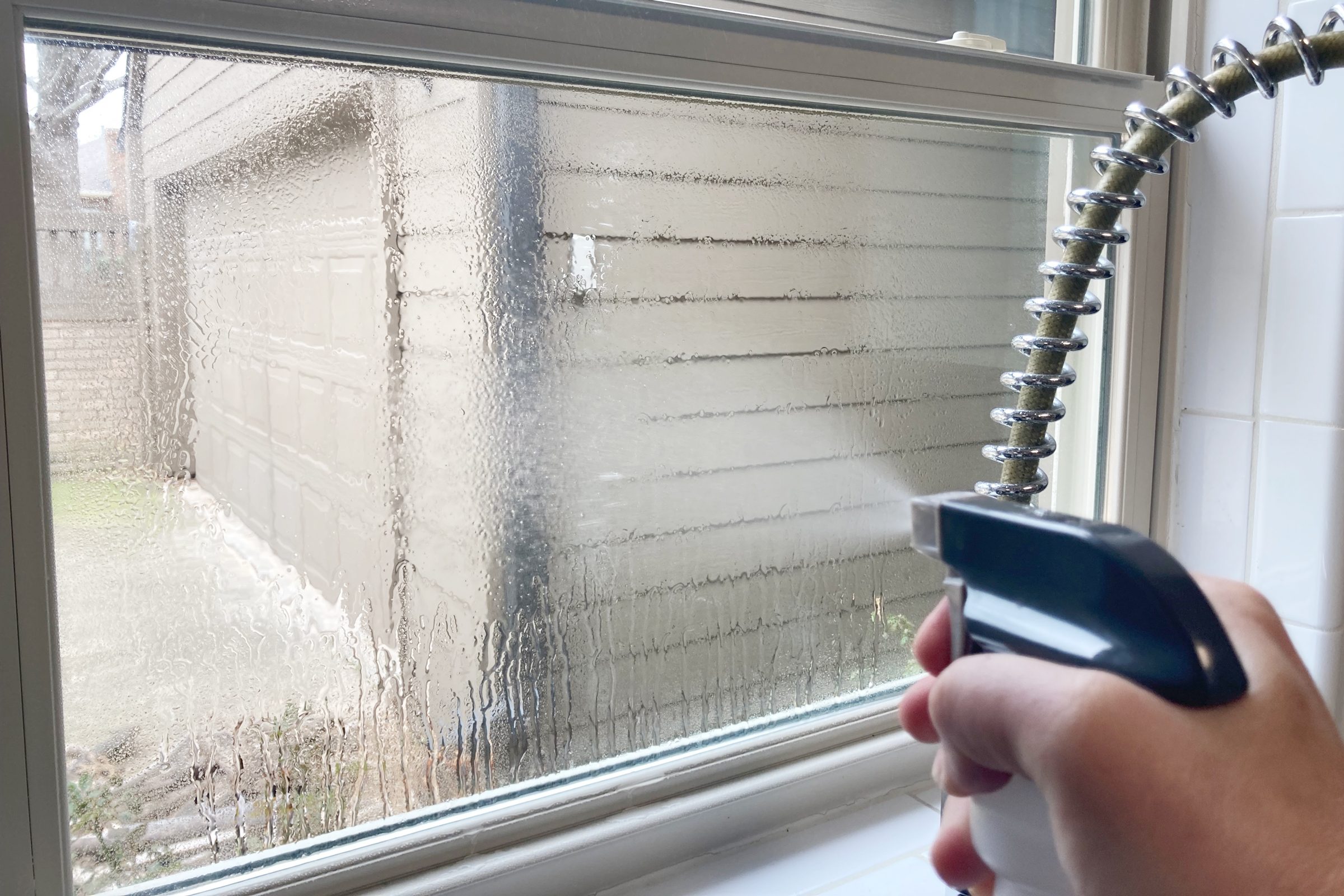 Spray Windows with spray bottle