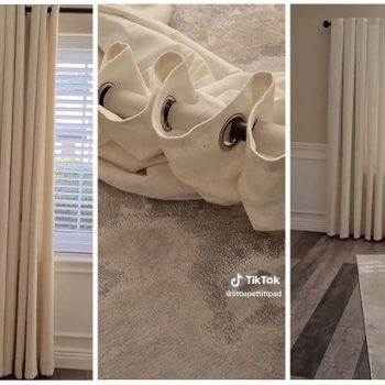 White curtains hang in a bright room, partially covering a window, while a rolled-up curtain fabric lies on a patterned rug next to a radiator.
