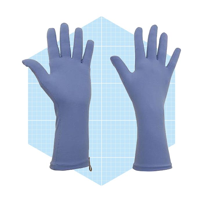 Blue rubber gloves are displayed flat, with fingers extended, against a light blue grid-patterned background. They are designed for protection during cleaning or handling substances.