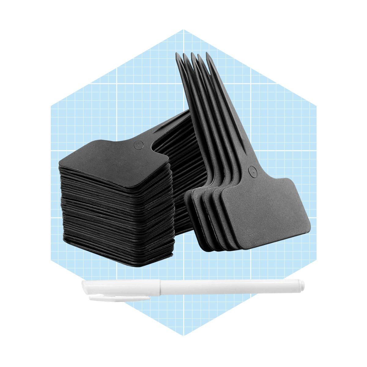 A stack of black plant labels stands upright beside a white marker, set against a light blue grid background.