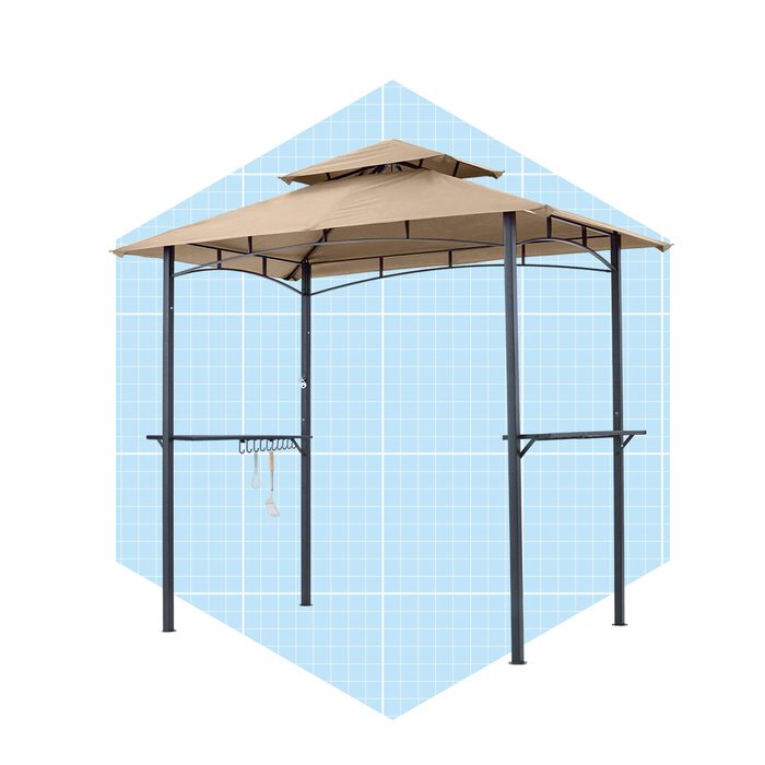 A large, tan gazebo stands on black metal poles, featuring a dual-tiered roof and hanging hooks. The background is a light blue grid pattern.