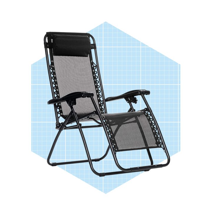 A black and gray reclining chair stands upright against a light blue geometric background, designed for relaxation with adjustable features and armrests.