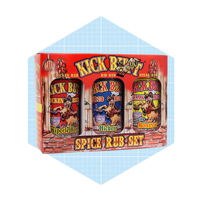 A spice rub set displayed in a decorative box contains three distinct seasoning jars labeled Chipotle Honey, Hickory, and Montreal, featuring vibrant, cartoonish designs.