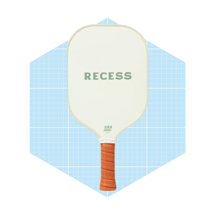 A paddle with a textured orange grip and the word 