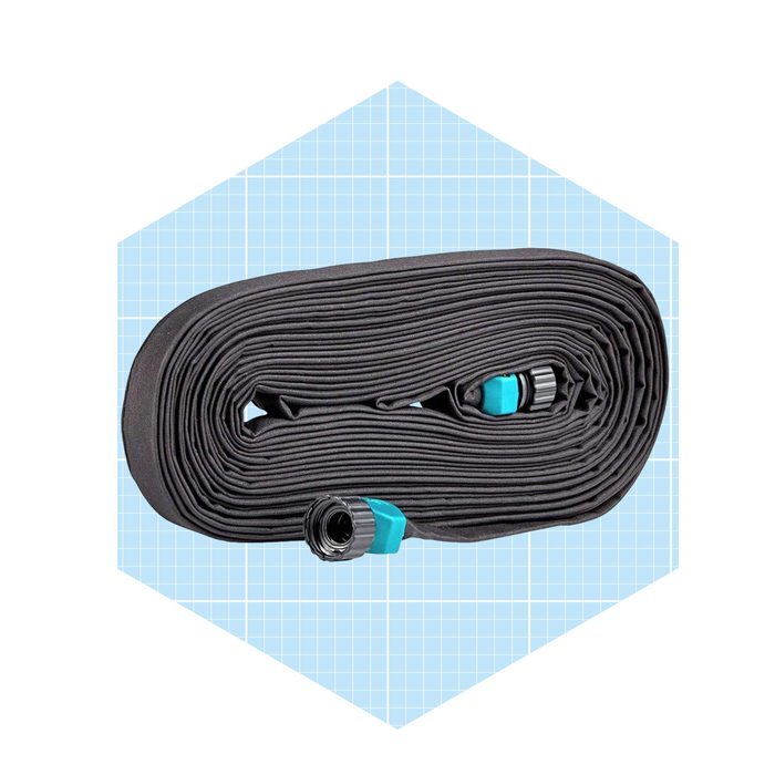 A coiled black garden hose with turquoise connectors rests against a light blue grid background, ready for use in watering or cleaning tasks.