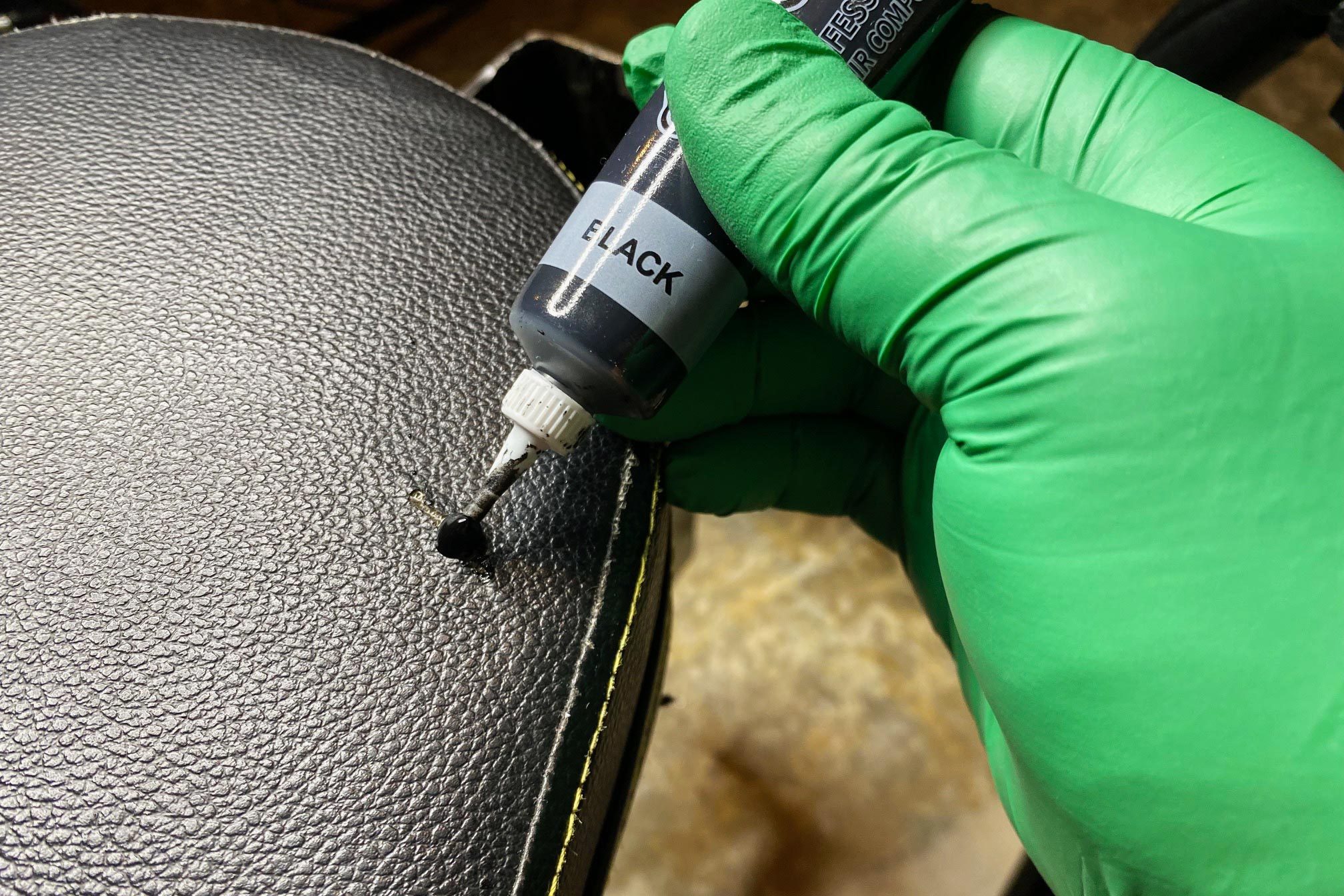 applying Repair Compound onto the cushion using a little squeeze bottle