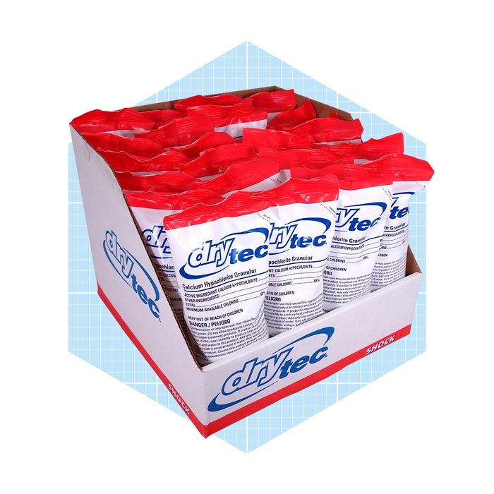 A box holds multiple packets of calcium hypochlorite granules, each labeled 