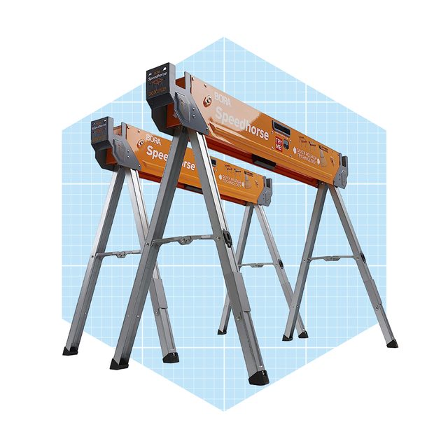 A pair of orange adjustable sawhorses stands upright, providing support for construction tasks, set against a light blue grid background.