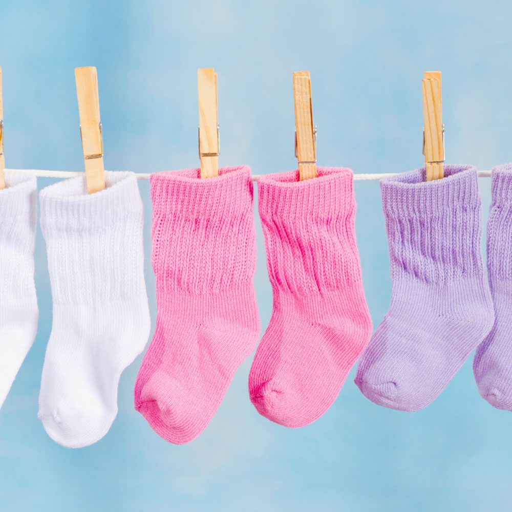 Baby Socks Hanging On A Clothesline