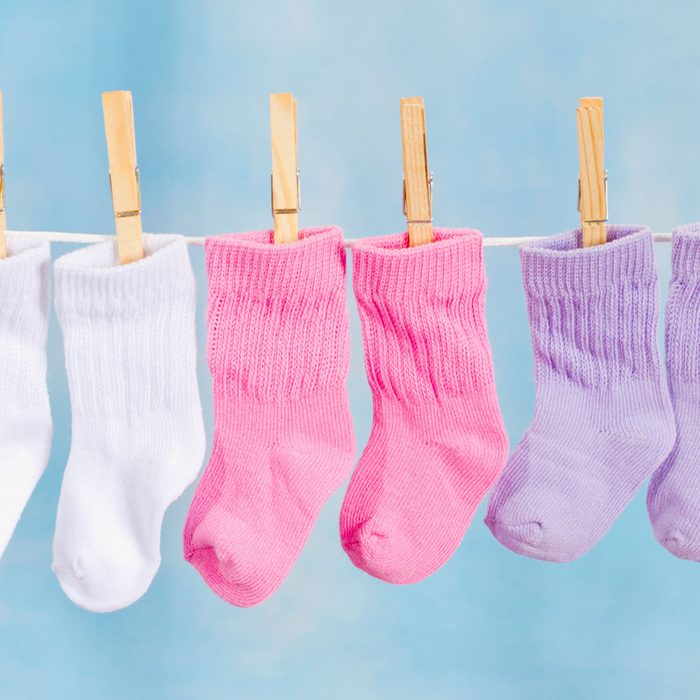 Baby Socks Hanging On A Clothesline