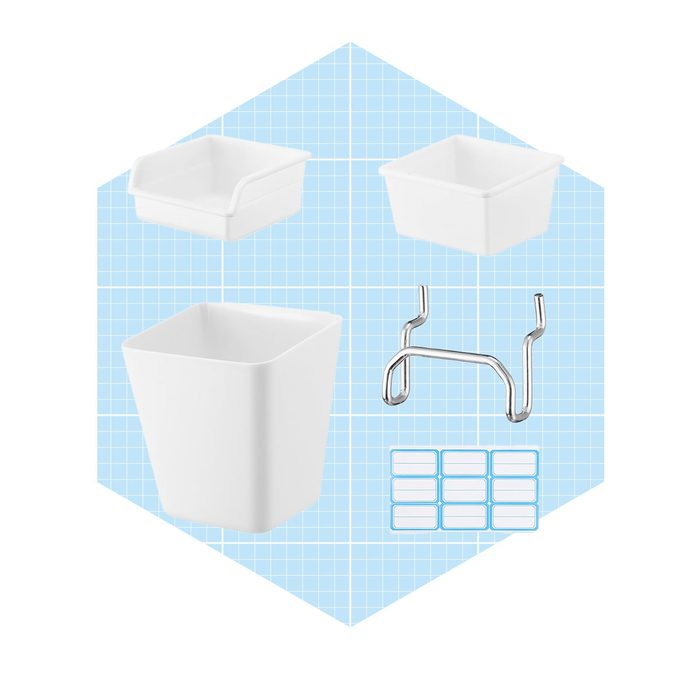 Four white containers and a metal hook are arranged on a light blue grid background, emphasizing their usability for storage or organization purposes.