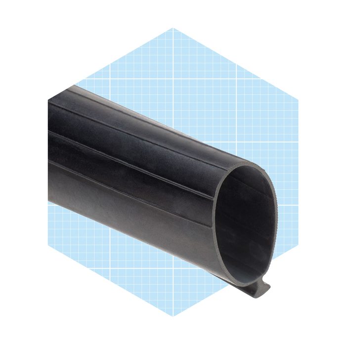 A black rubber tube with a smooth exterior and open end rests against a blue grid background, suggesting it’s meant for industrial or mechanical use.