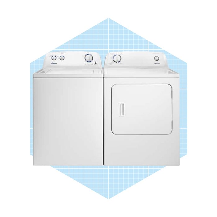 A washing machine and dryer are positioned side by side, featuring white exteriors and control dials, set against a light blue grid background.