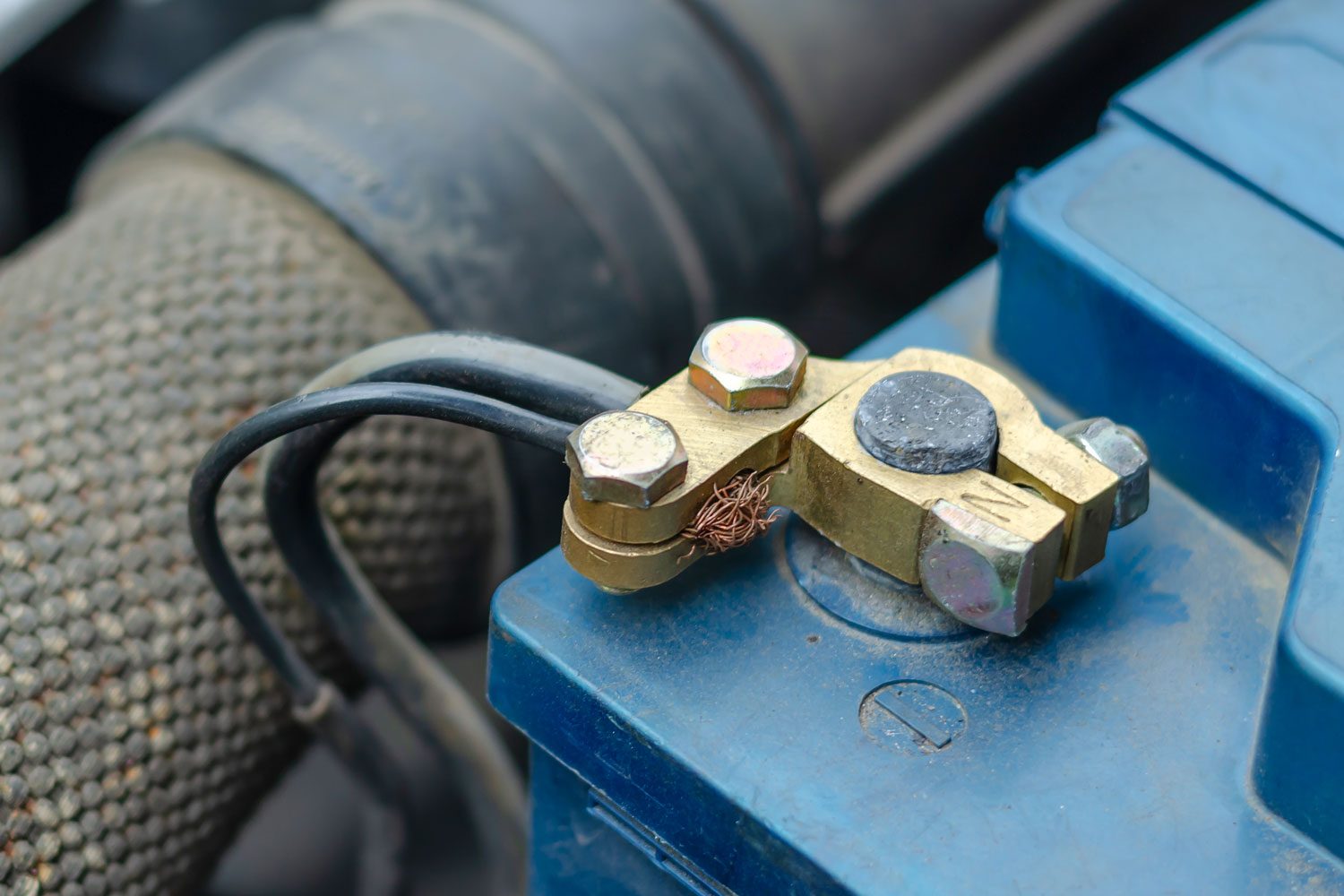 Close Up Of The Negative Terminal Of A 12 volt Blue Battery.